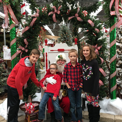 Children posing with Santa inside of Walnut Ridge.